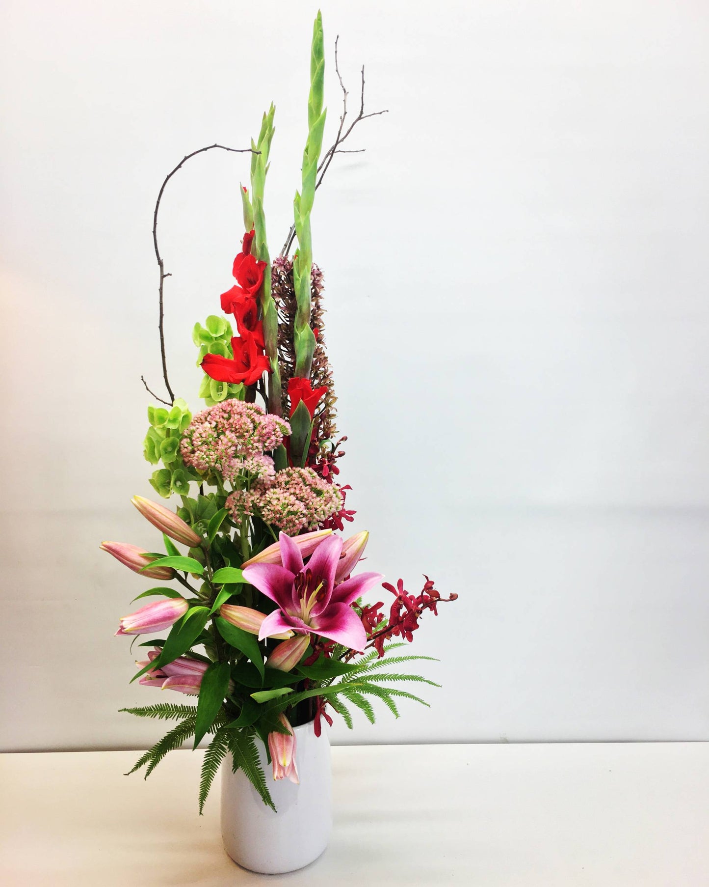 tall linear arrangement in bright colors for delivery on the Sunshine Coast