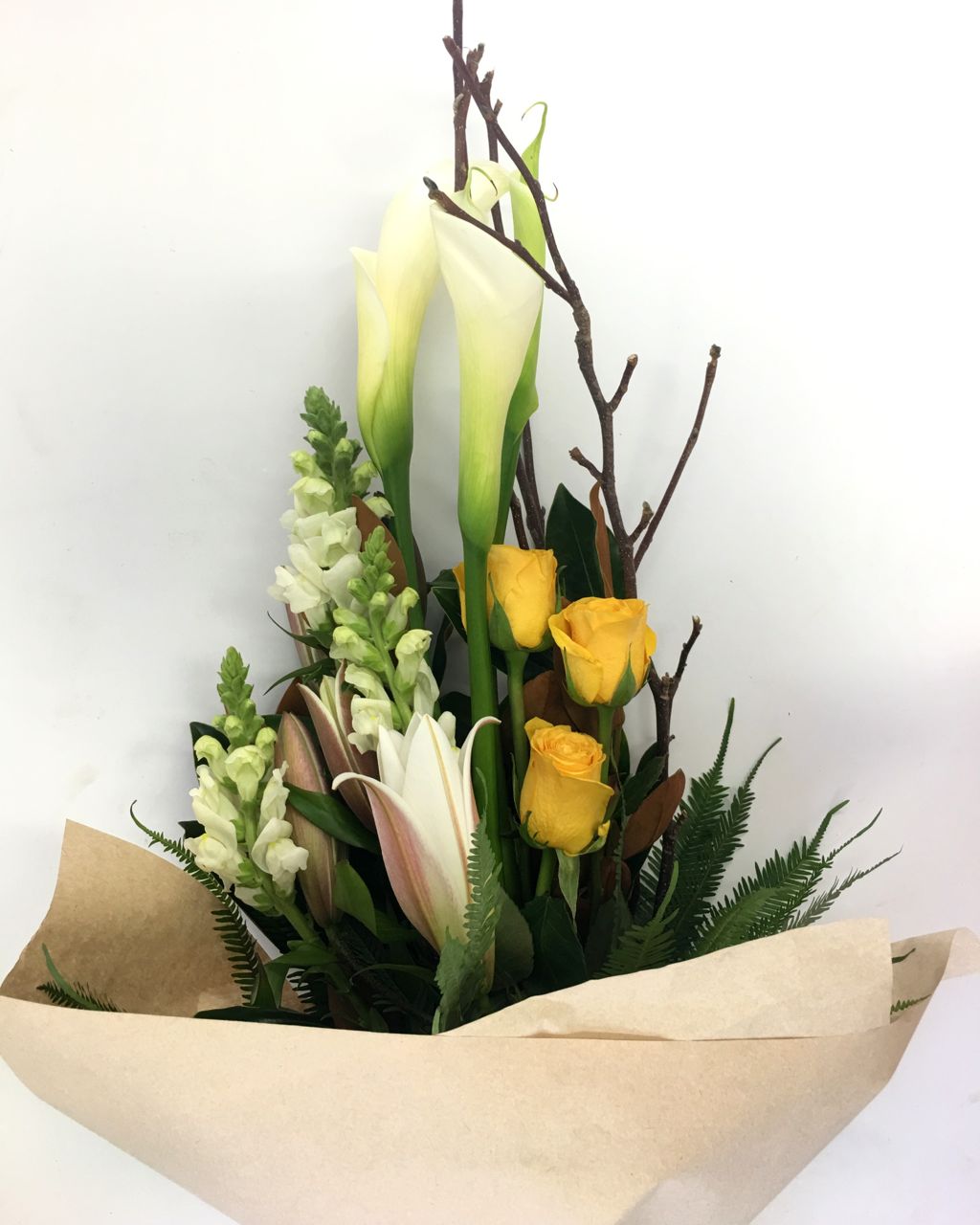 tall linear bouquet modern style in soft colors, gift wrapped for delivery on the Sunshine Coast
