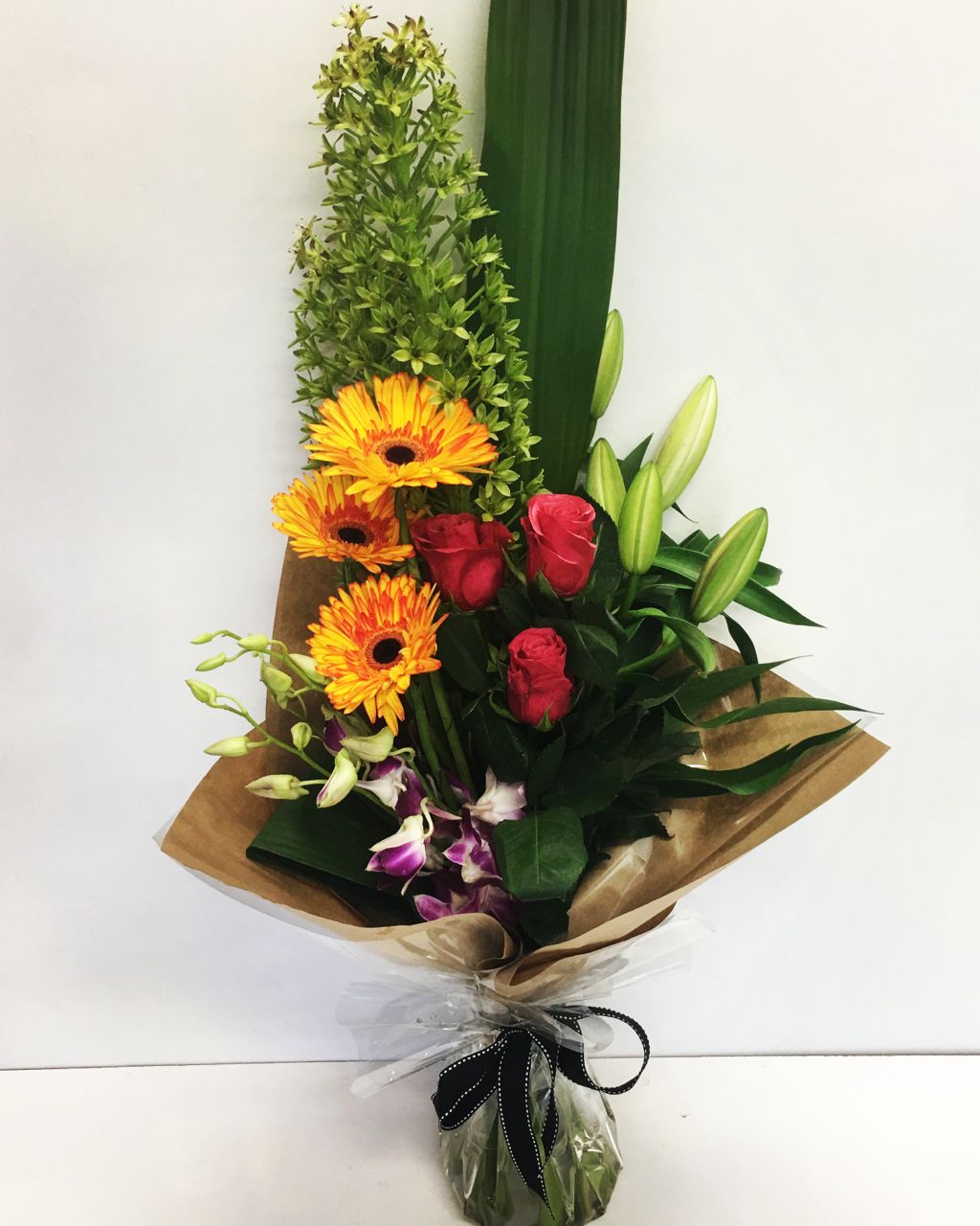 Modern Tall flower bouquet in bright colors gift wrapped for delivery on the Sunshine Coast