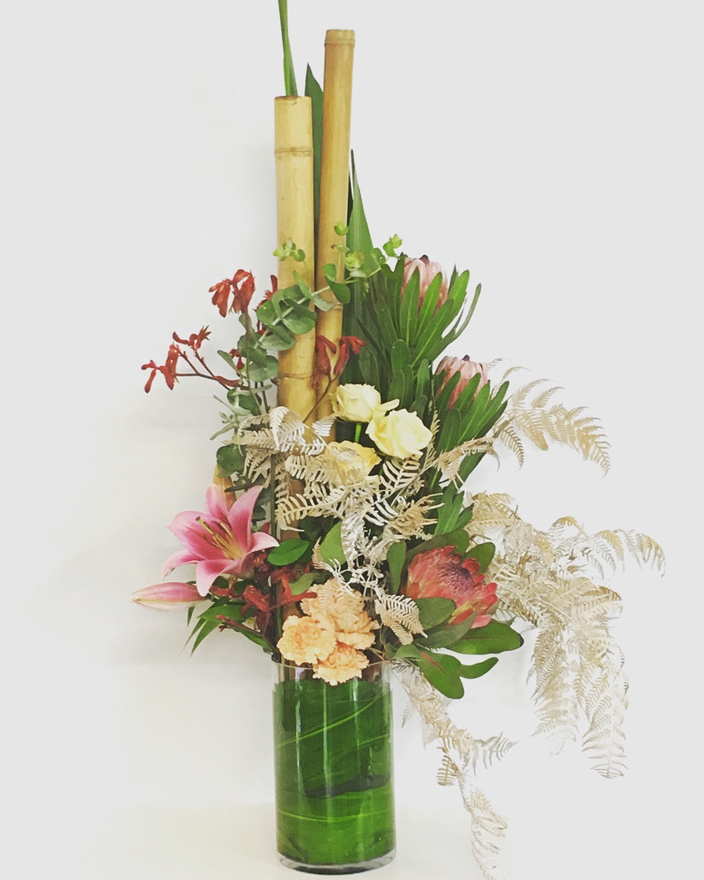 modern tall flower arrangement in pastel colours
