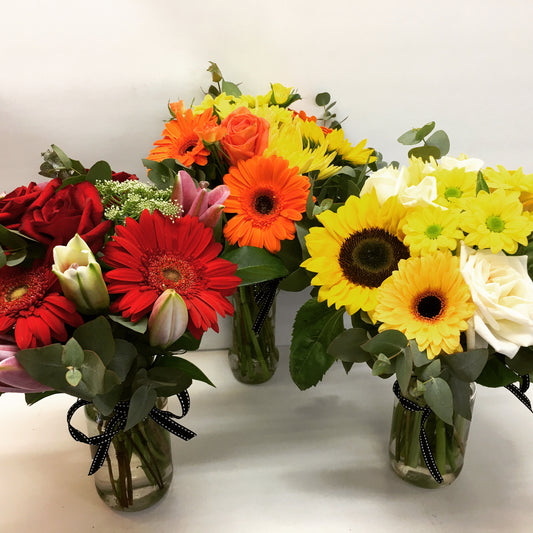 posy of flowers in a jar