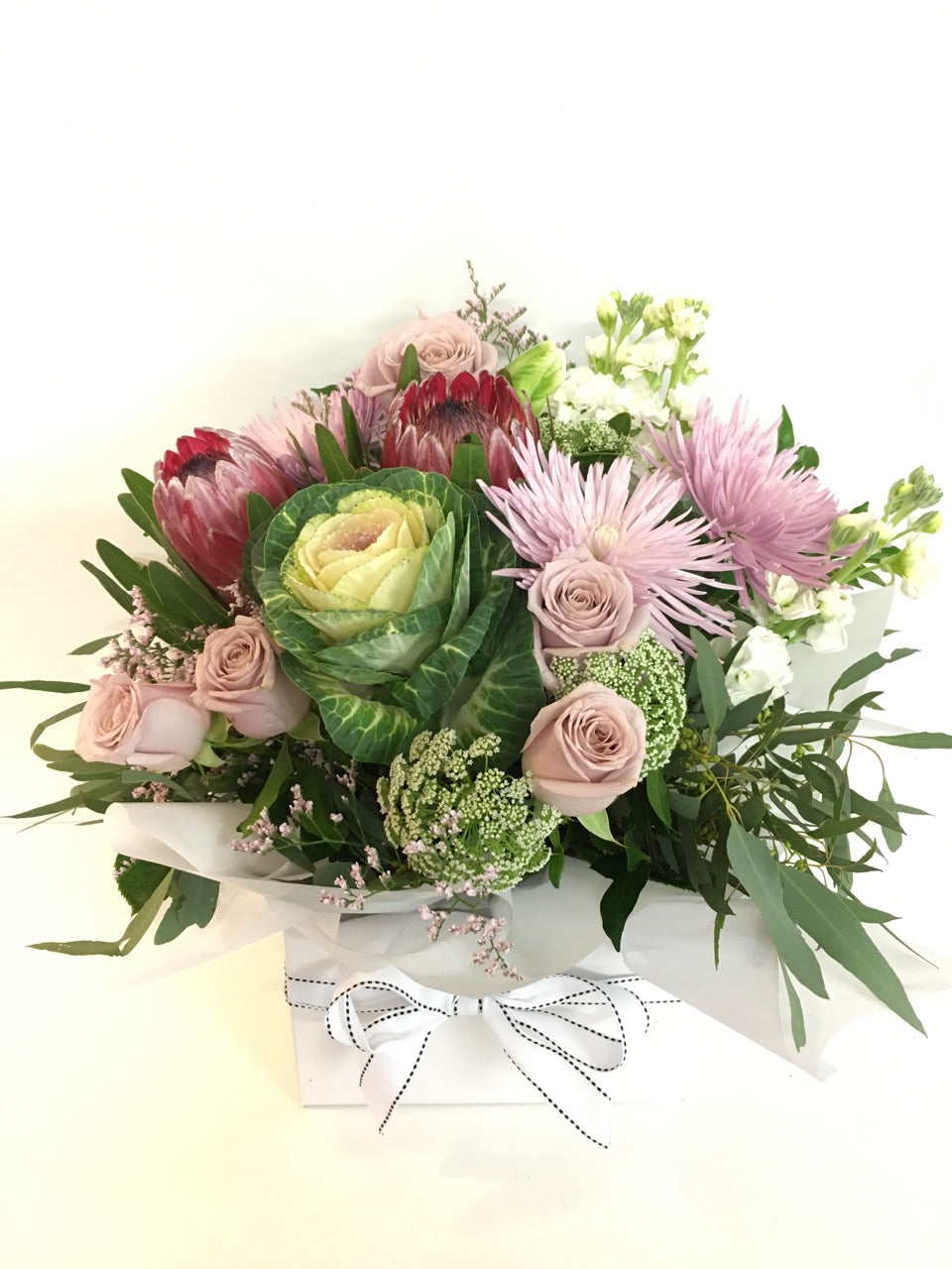 Box of flowers in soft colors for delivery on the Sunshine Coast