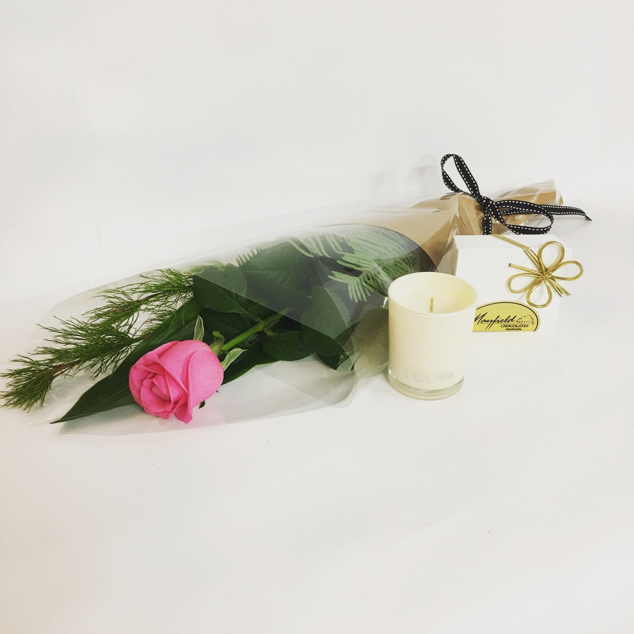 1 single rose with green gift wrapped with candle and 50g bar of chocolate