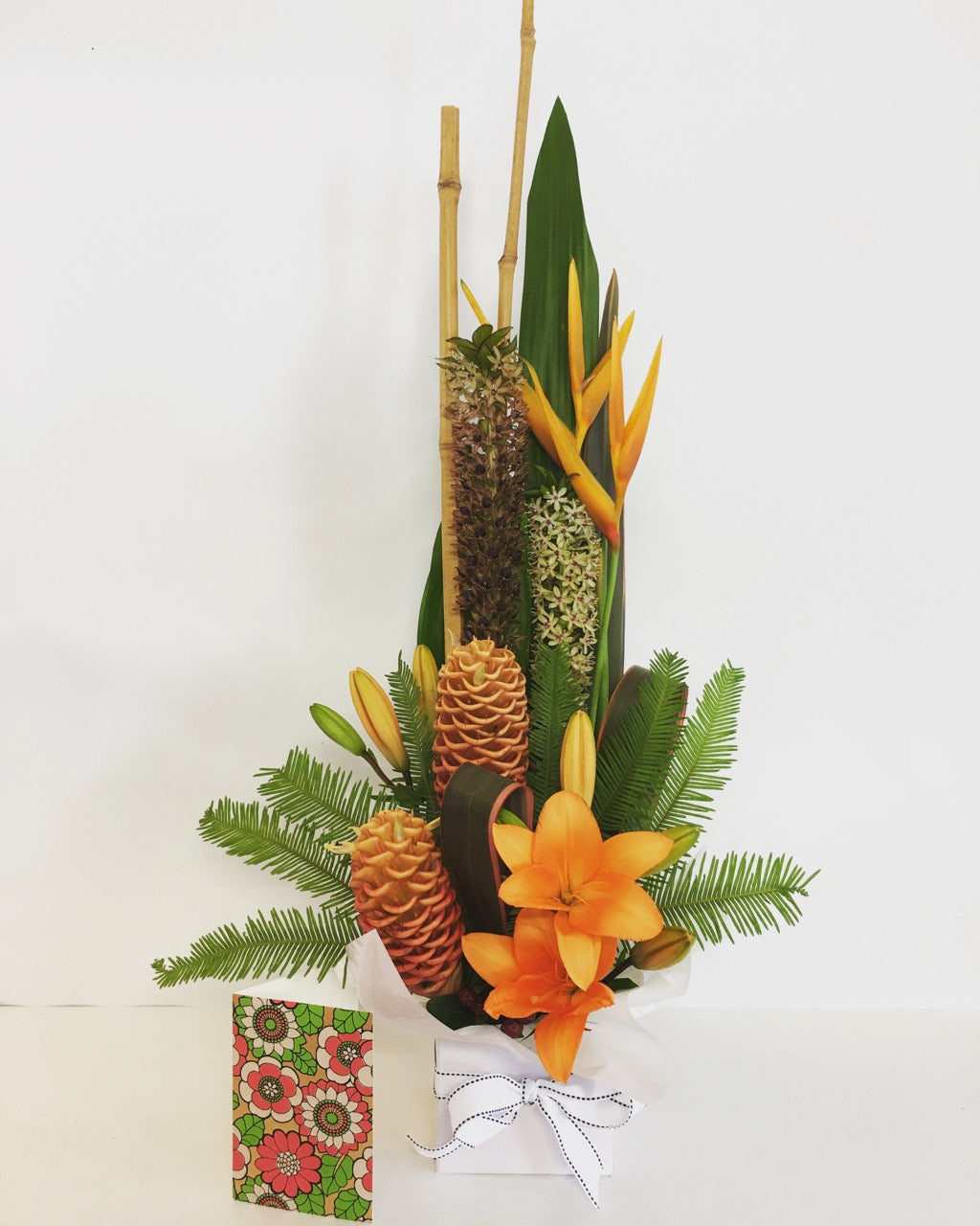 Modern tall flower arrangement in bright colors