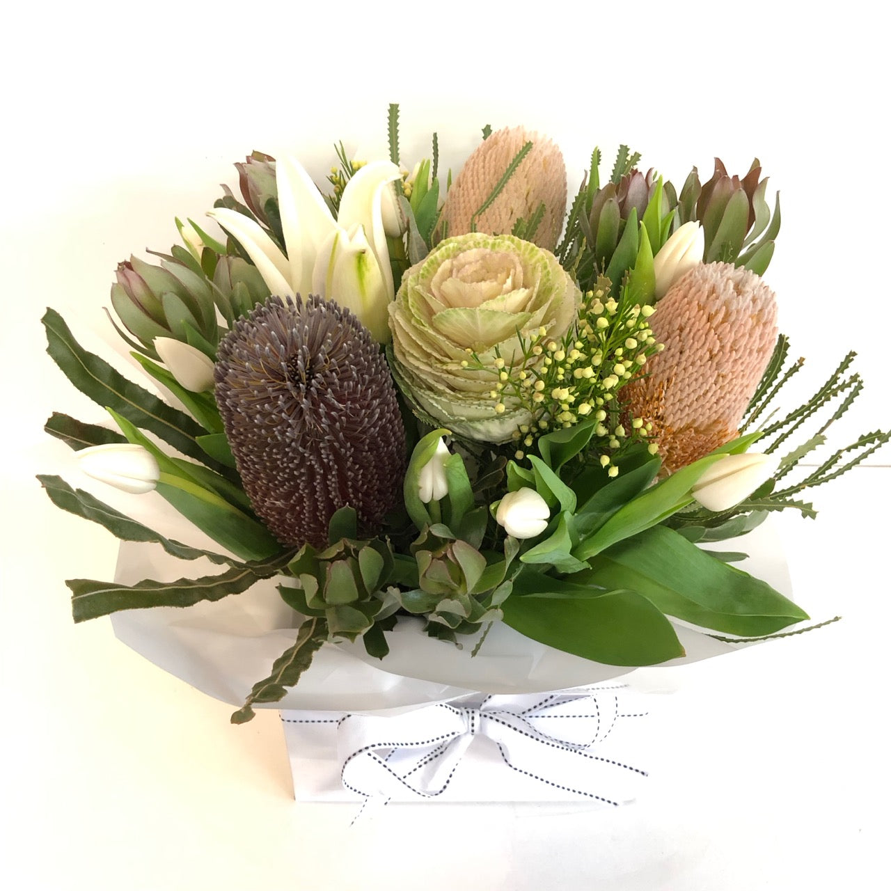 Box of flowers in soft tones for delivery on the Sunshine Coast 