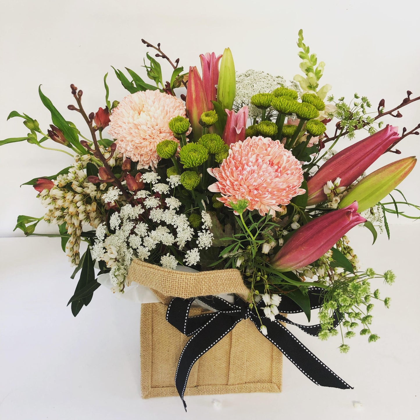 Rustic flower Arrangement in a hessian Bag for delivery on the Sunshine Coast 