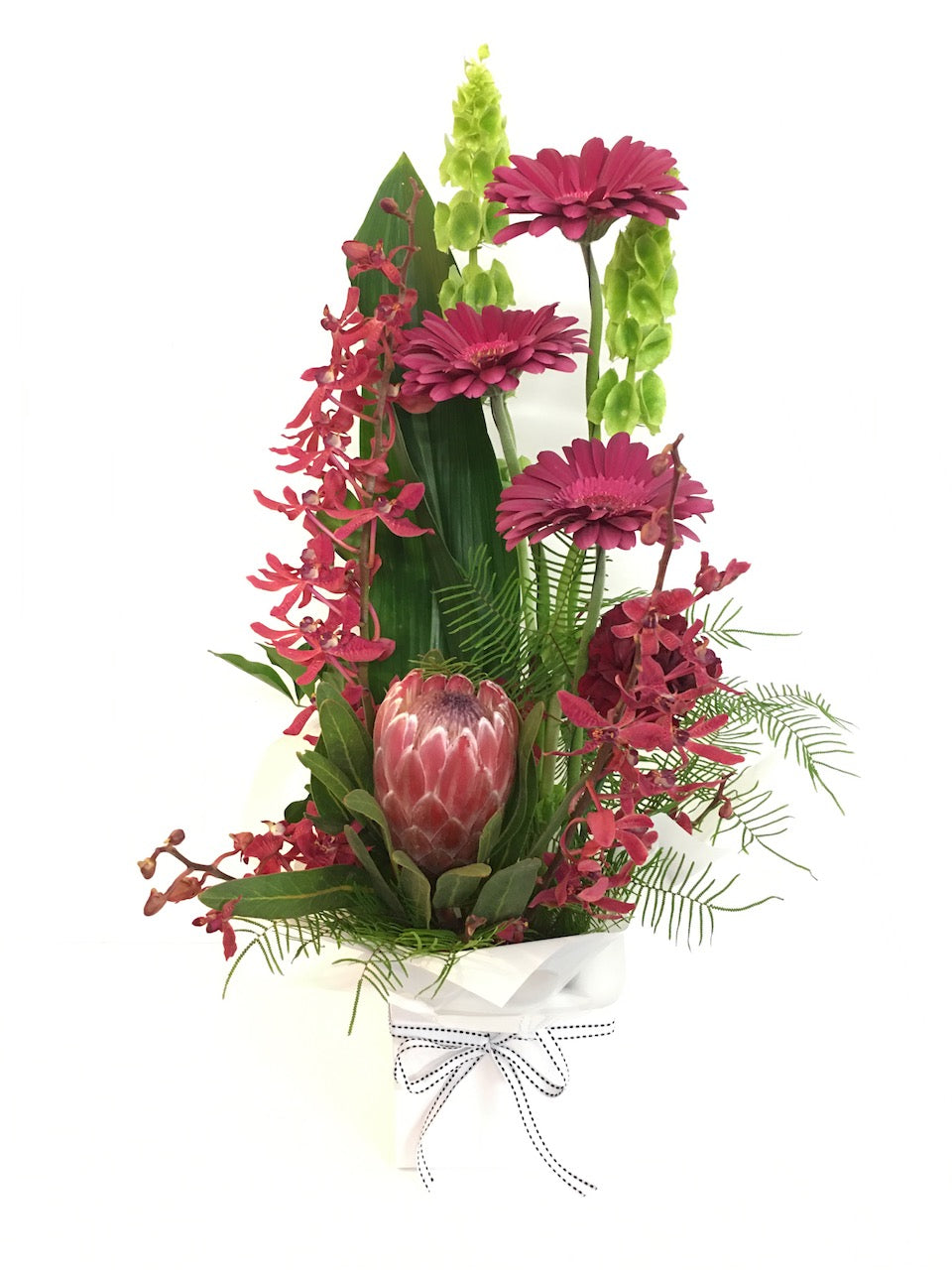 tall flower arrangement in bright colors 